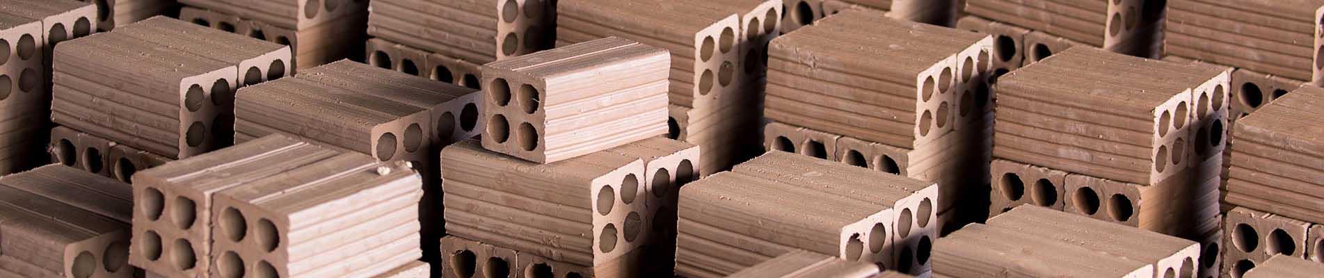 Coatings to minimize wear in ceramic tile manufacturing